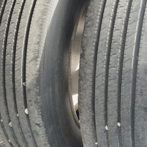 Wheel and tire stack on a used 2017 Manac Cal Legal Combo Drop Deck trailer showing multiple tires and rims.