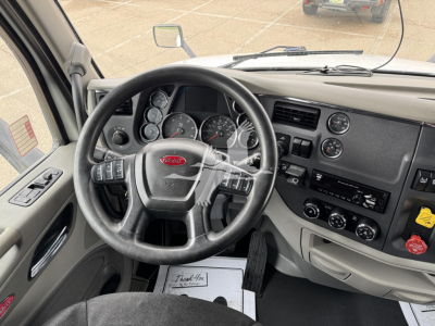 Peterbilt 579 interior cockpit showing steering wheel and dashboard gauges