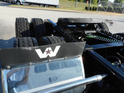 Chassis area of a new Western Star 49X showing rear dual tires and chassis rails with air lines, frame, and sixth wheel area.