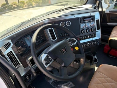 Western Star 49X cab interior shown from driver side with steering wheel, dashboard gauges, and control panels.