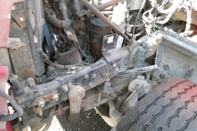 Mack RD688S chassis showing engine bay and suspension components with hoses and brackets.