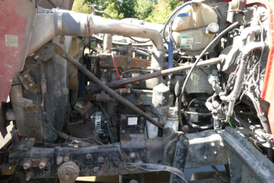 Mack RD688S engine bay showing main components and hydraulic lines in view