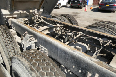 Mack RD688S chassis and rear suspension showing dual rear axles and frame rails with exposed components.