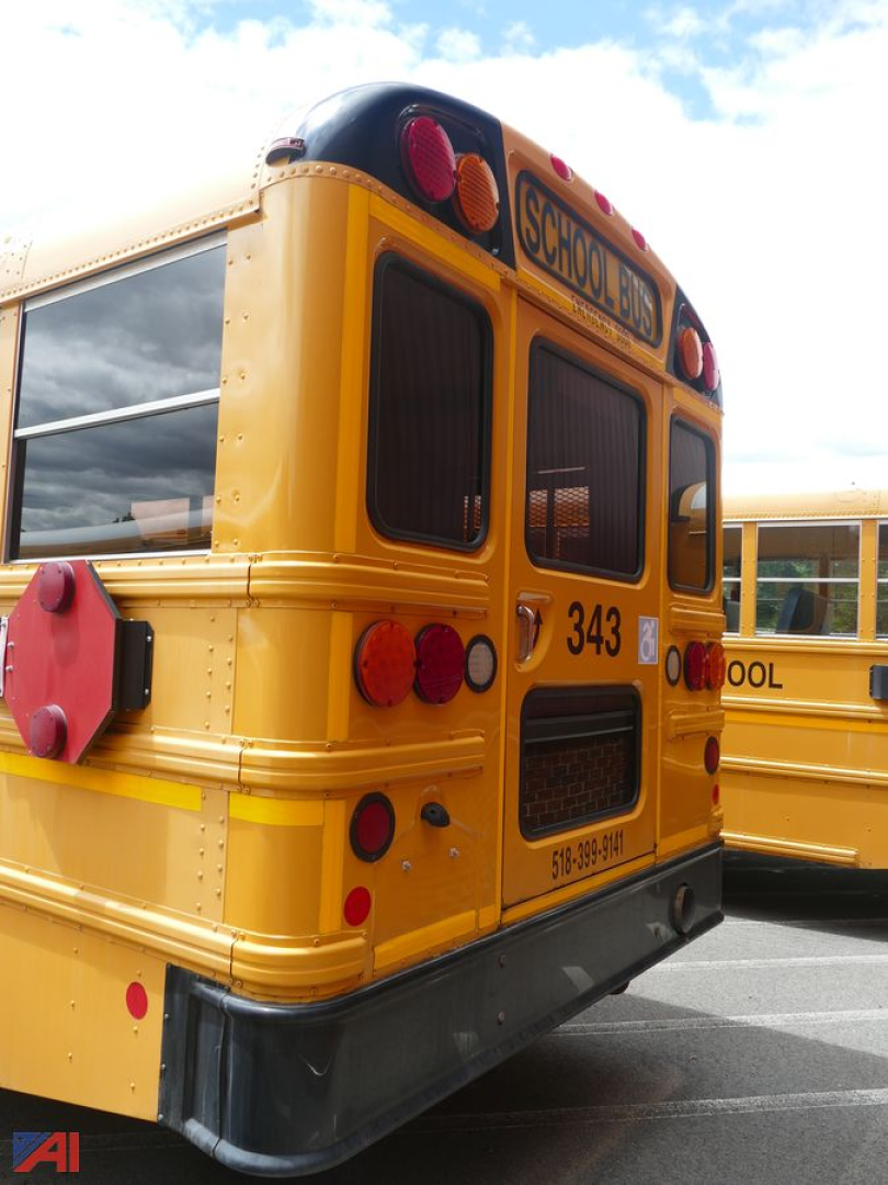 Rear view of a yellow school bus with wheelchair lift, model year 2017, bus id 343, showing School Bus signage and rear lights.