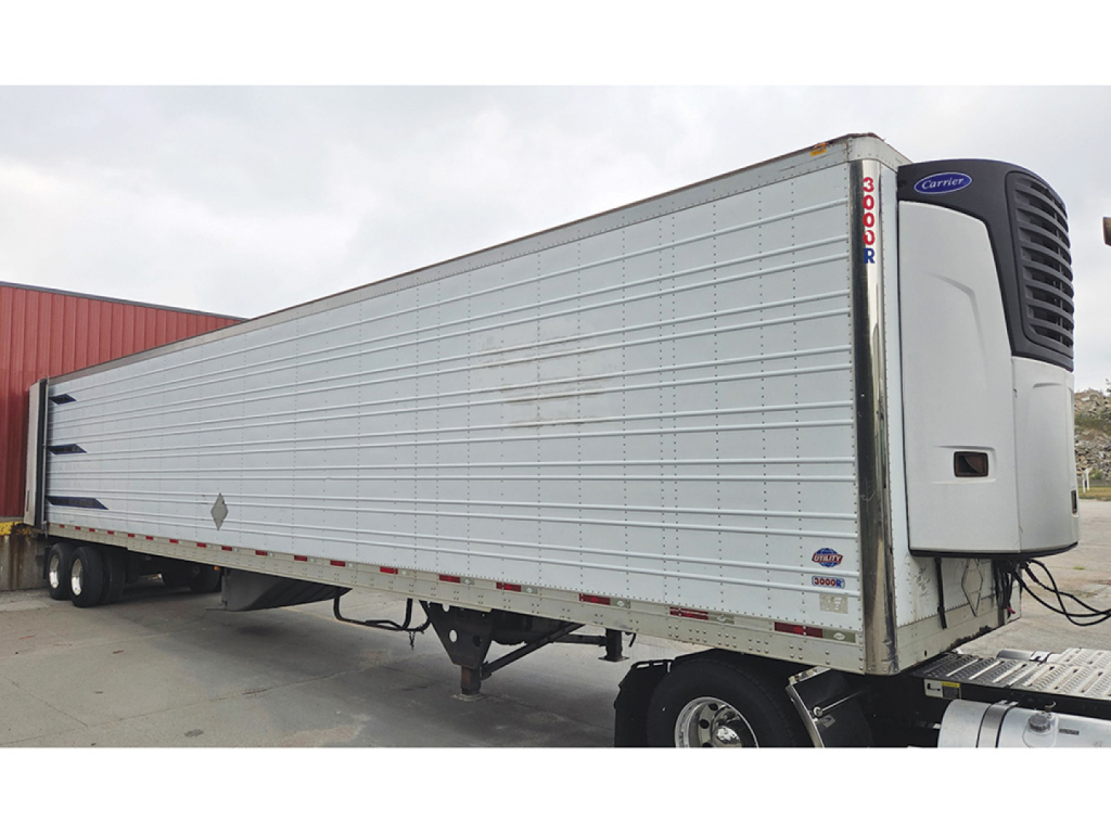 Utility 3000R trailer with refrigeration unit showing EM957201 VIN and stock number 555947.