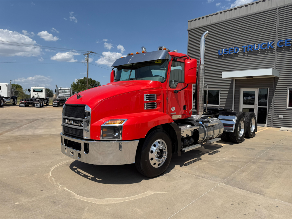 Truck: 2022 Mack ANTHEM conventional daycab, red exterior, front-left view parked outside dealership with stock number B3669P and VIN 1M1AN4GY2NM025975.