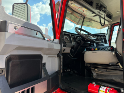Truck cab interior of a 2022 Mack Anthem showing steering wheel, dashboard, and driver's seat