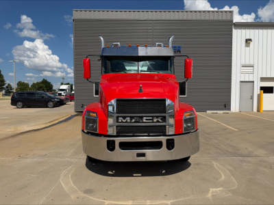 Front view of a red 2022 Mack Anthem conventional daycab truck showing prominent Mack grille and bumper.