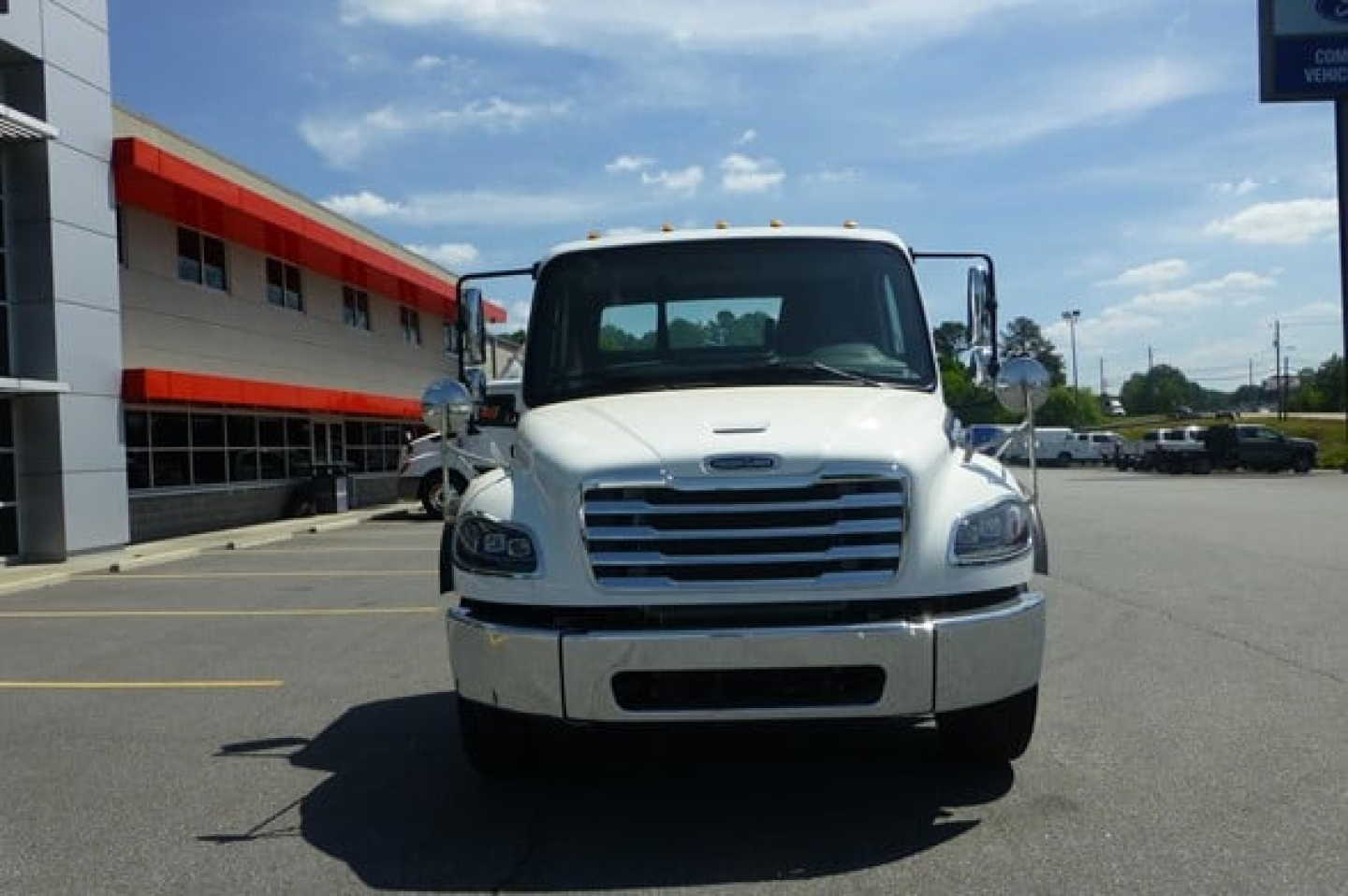 Front view of a white 2027 Freightliner M2 106 Plus cab and chassis truck showing grille, headlights, and bumper.