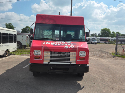 Front view of a red 2020 Ford food truck with 'thymes 4.0' on the hood and a chrome grille.