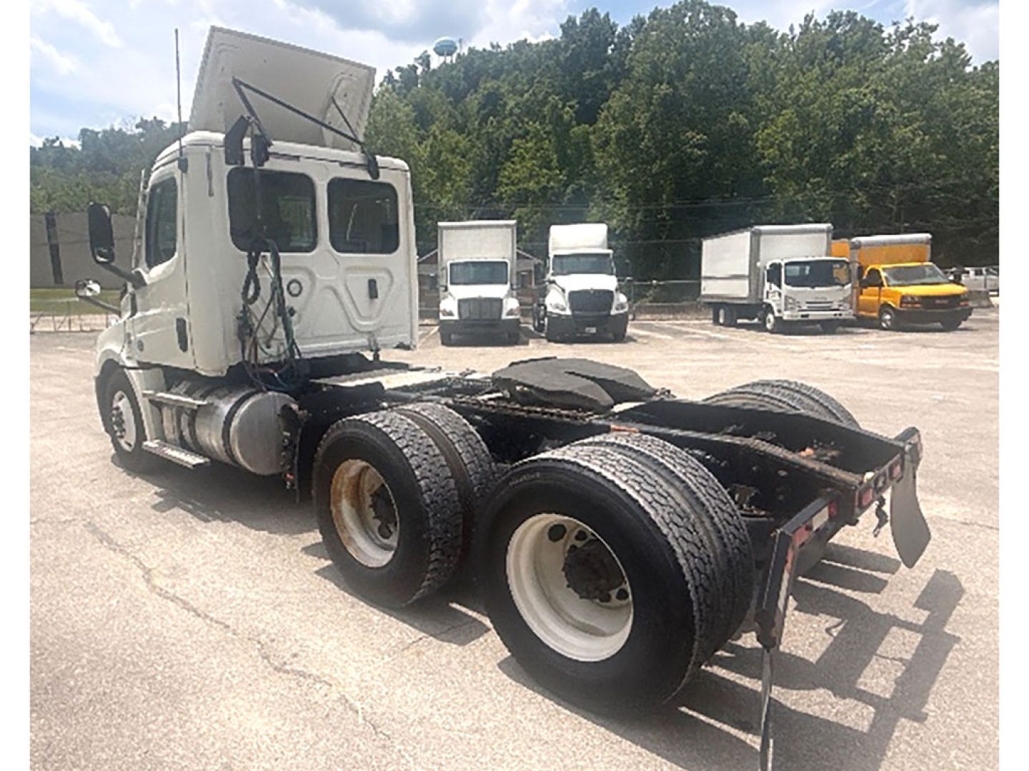 Vehicle chassis of a 2020 Freightliner Cascadia126 tractor showing rear dual axles and fifth wheel area.
