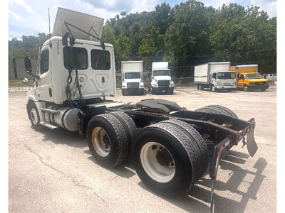 Vehicle chassis of a 2020 Freightliner Cascadia126 tractor showing rear dual axles and fifth wheel area.