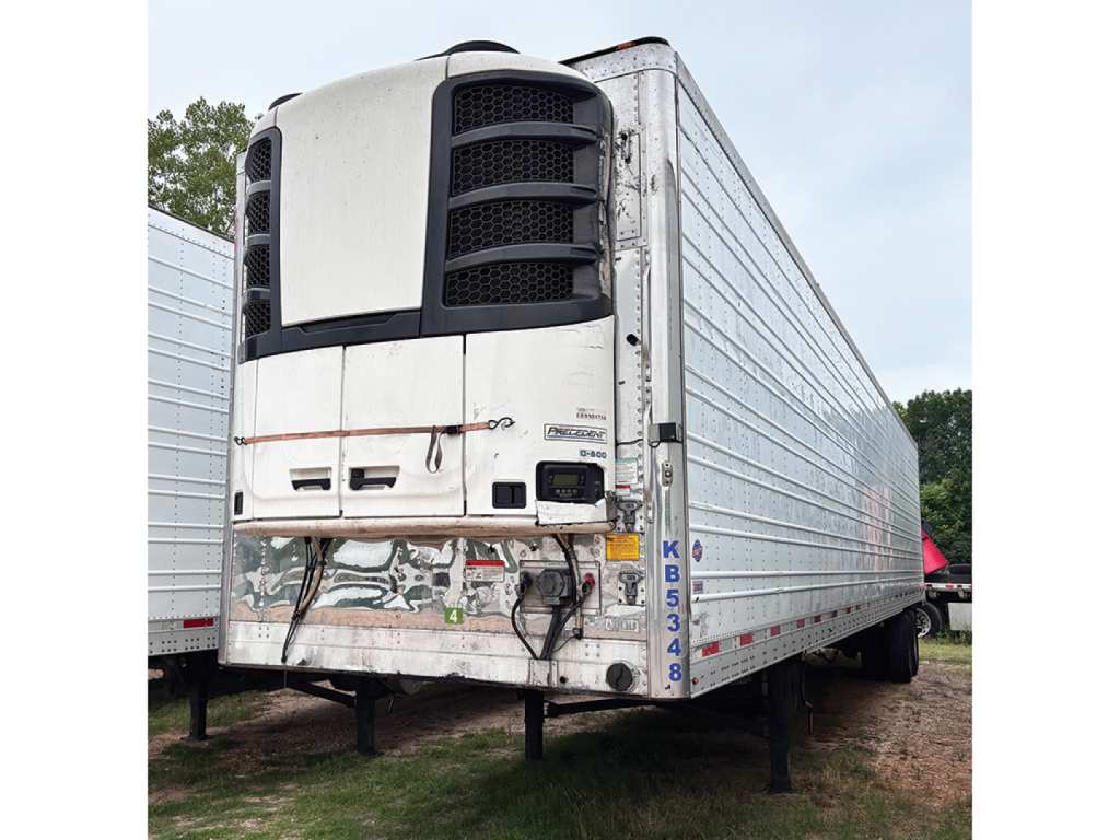 Rear/left side of a used 2019 Utility 3000R refrigerated trailer showing a large white cab and refrigeration unit, with side panel ribbed trailer and landing gear visible.