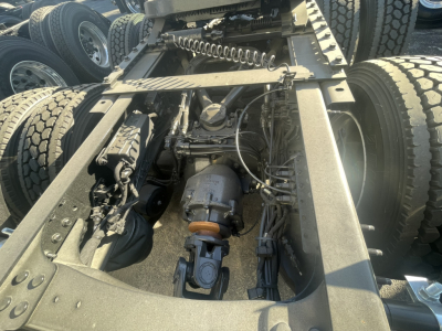 Volvo VNL54/VNL64 truck chassis showing drivetrain and air lines with fifth wheel and rear suspension, engine bay obscured.