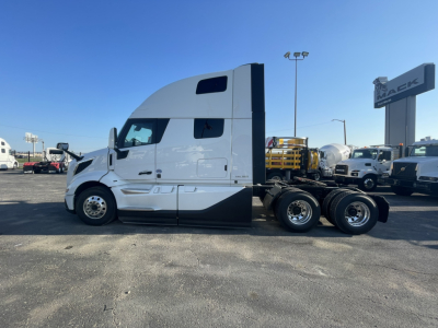 Volvo VNL64T860 tractor-trailer side profile showing cab and rear wheels.