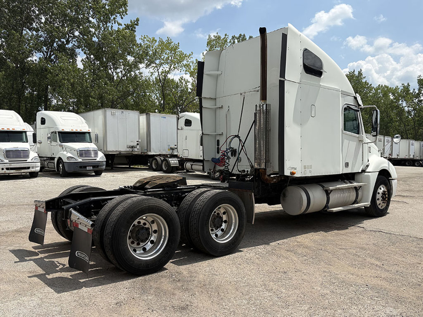 2013 Freightliner CL120 Columbia sleeper cab with tractor chassis shown from side rear, stock number 556191, VIN 1FVXA7001DLFF2554, heavy truck with dual rear axles.