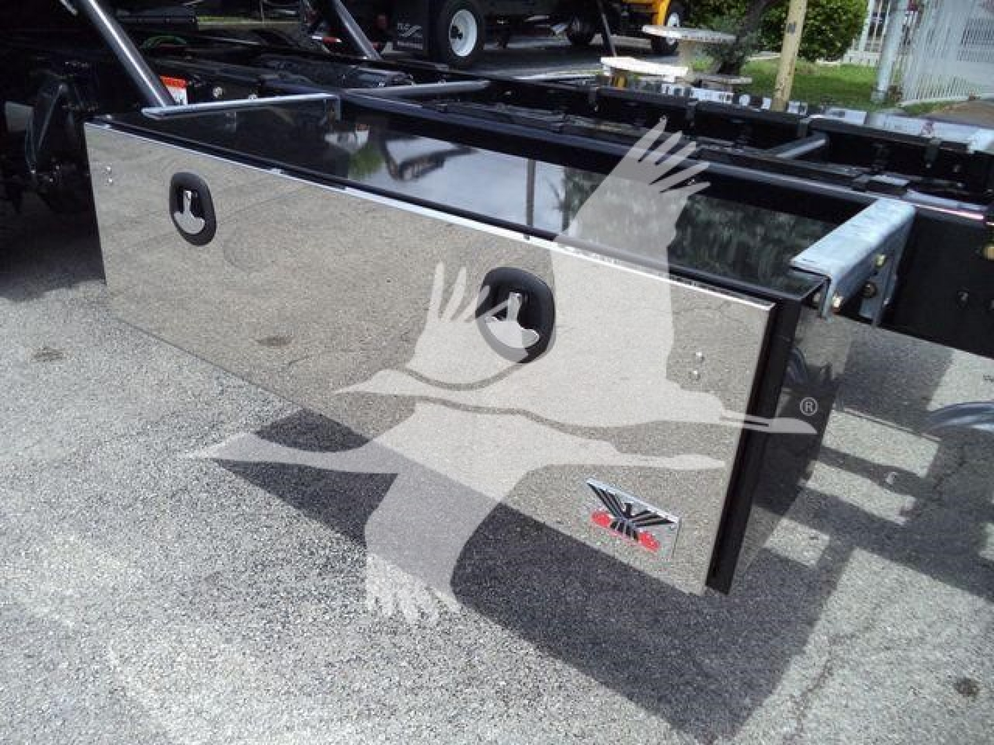 Freightliner M2 106 rollback body panel showing diamond plate toolbox and KC-style handles.