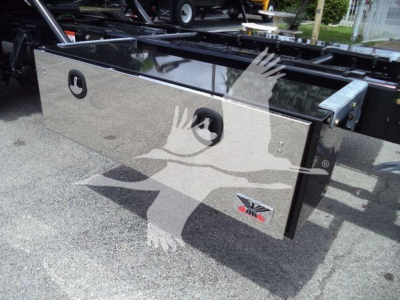 Freightliner M2 106 rollback body panel showing diamond plate toolbox and KC-style handles.