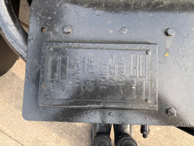 Kenworth T880 engine bay component showing a labeled switch panel with OFF/ON and STORAGE/LINK? markings.