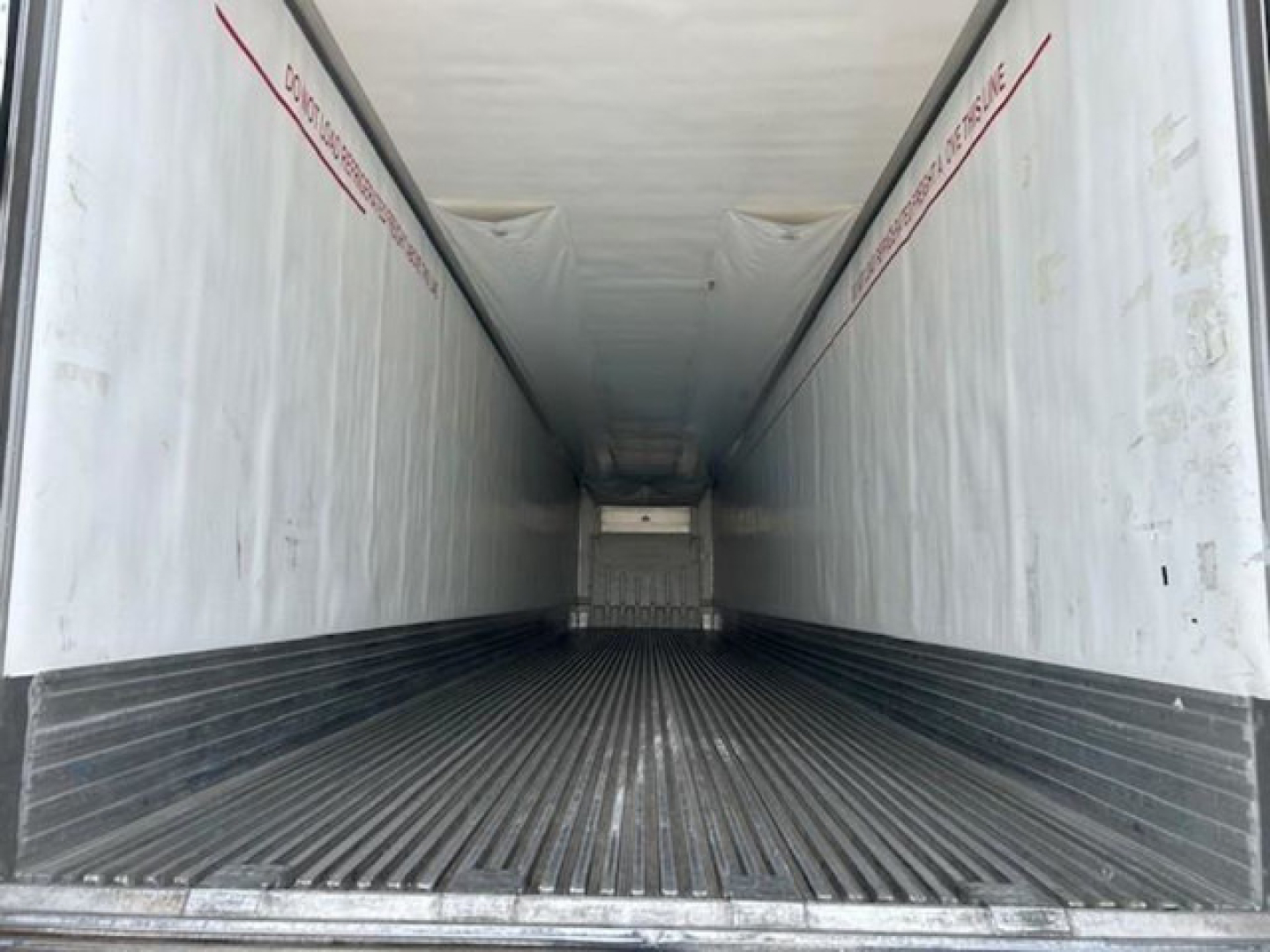 Trailer interior of a 2019 Utility Reefer showing empty cargo area with ribbed floor and light-colored walls.
