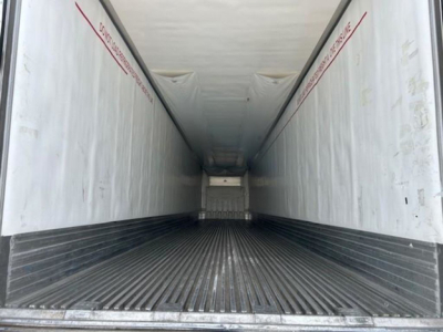 Trailer interior of a 2019 Utility Reefer showing empty cargo area with ribbed floor and light-colored walls.