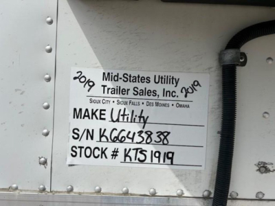 Trailer side tag reading: Mid-States Utility Trailer Sales, Inc. Make Utility S/N K6643838 Stock # KTS1919. Handwritten year 2019 on top left and 2019 on top right.