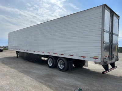 Trailer side view of a 2019 refrigerated utility trailer with tandem axles and a rear ramp door, labeled stock KTS1919.