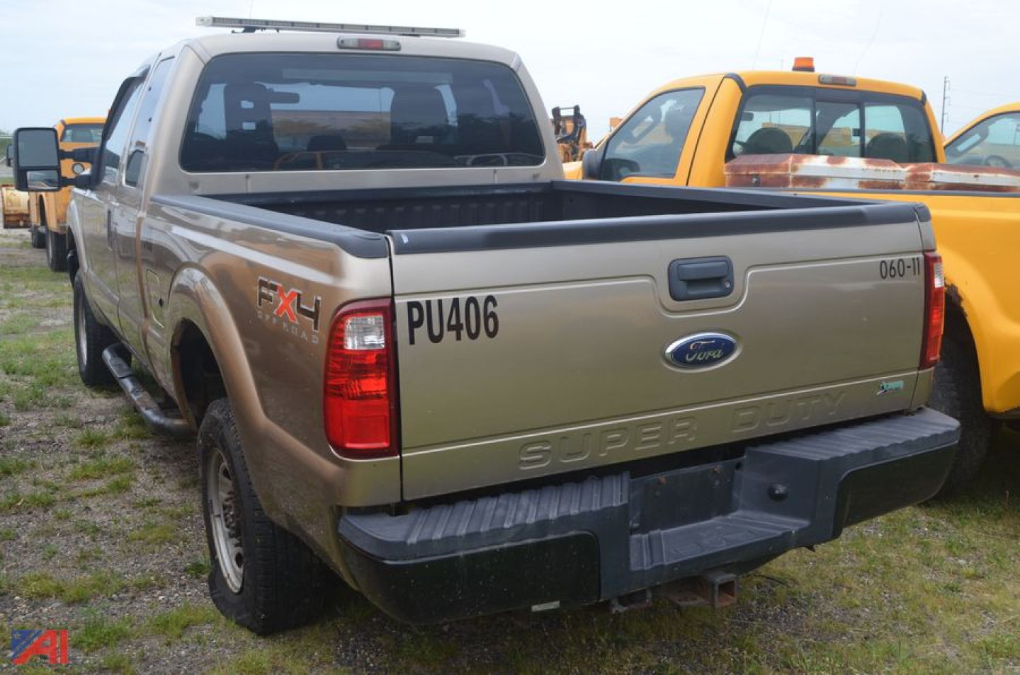 Ford F-250 Super Duty pickup bed showing PU406 decal and FX4 badge on tailgate
