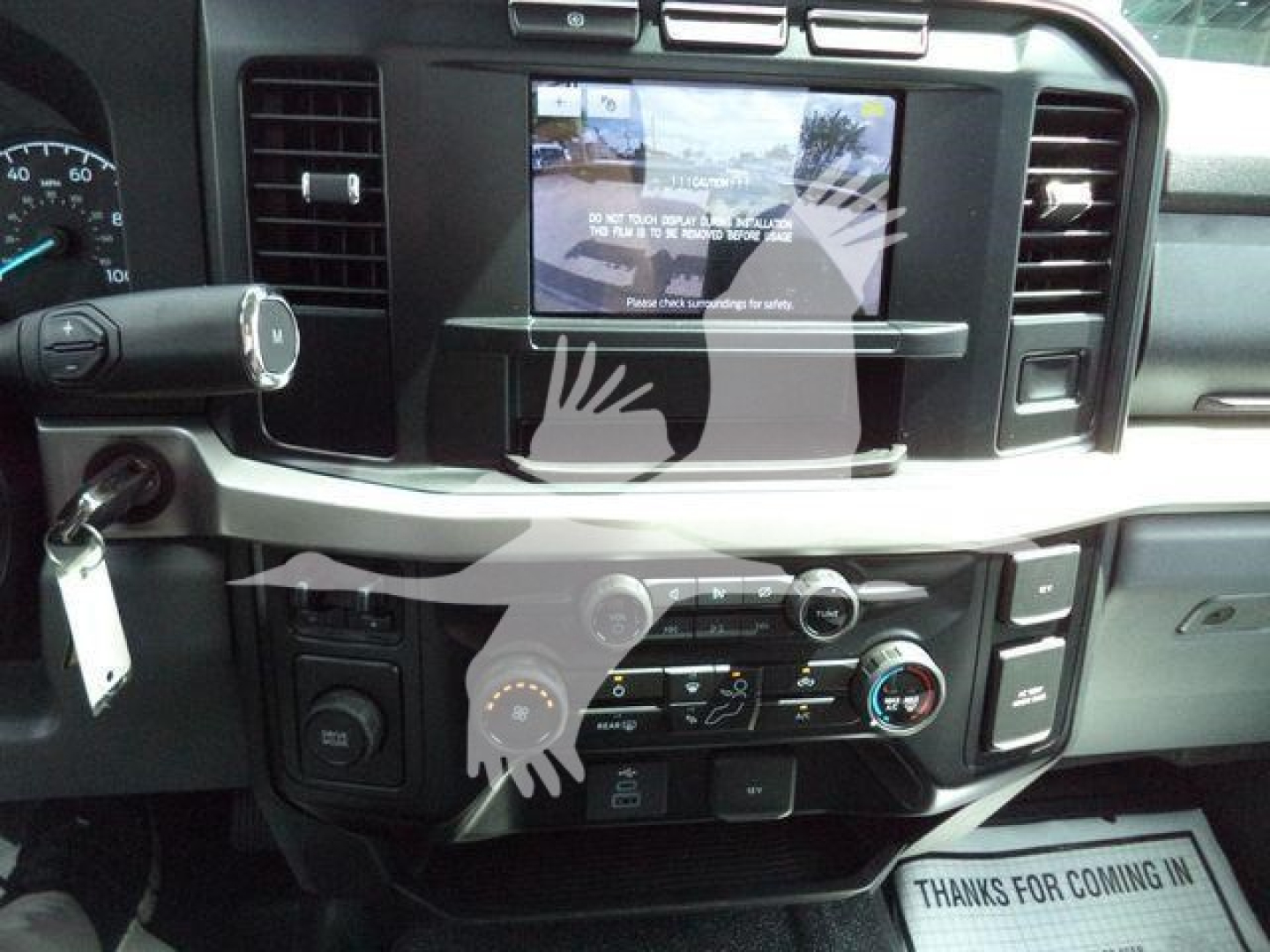 Dashboard view of a 2024 Ford F-550 interior showing center touchscreen, climate controls, and USB/power ports.