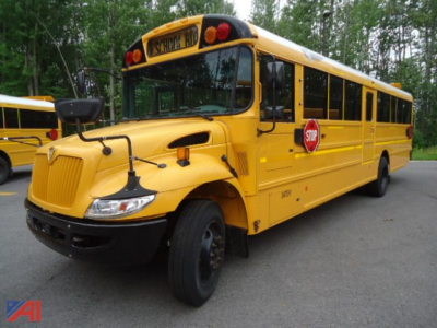 IC Corporation CE Series school bus in yellow, side view with stop sign extended, front engine area and black bumper visible.