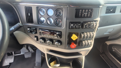 Peterbilt 579 dash and instrument cluster showing gauges and switches in the cab