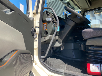 Volvo VNL300 cab interior with steering wheel, dashboard, and driver's seat visible