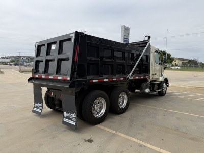 Volvo VNL300 dump truck showing rear and side view with dump bed, dual rear axles, mud flaps, and black dump body.