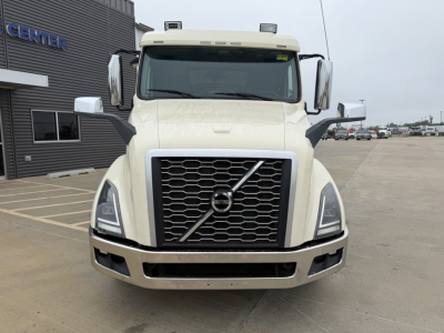Volvo VNL300 front view showing grille and headlights with bumper and side mirrors.