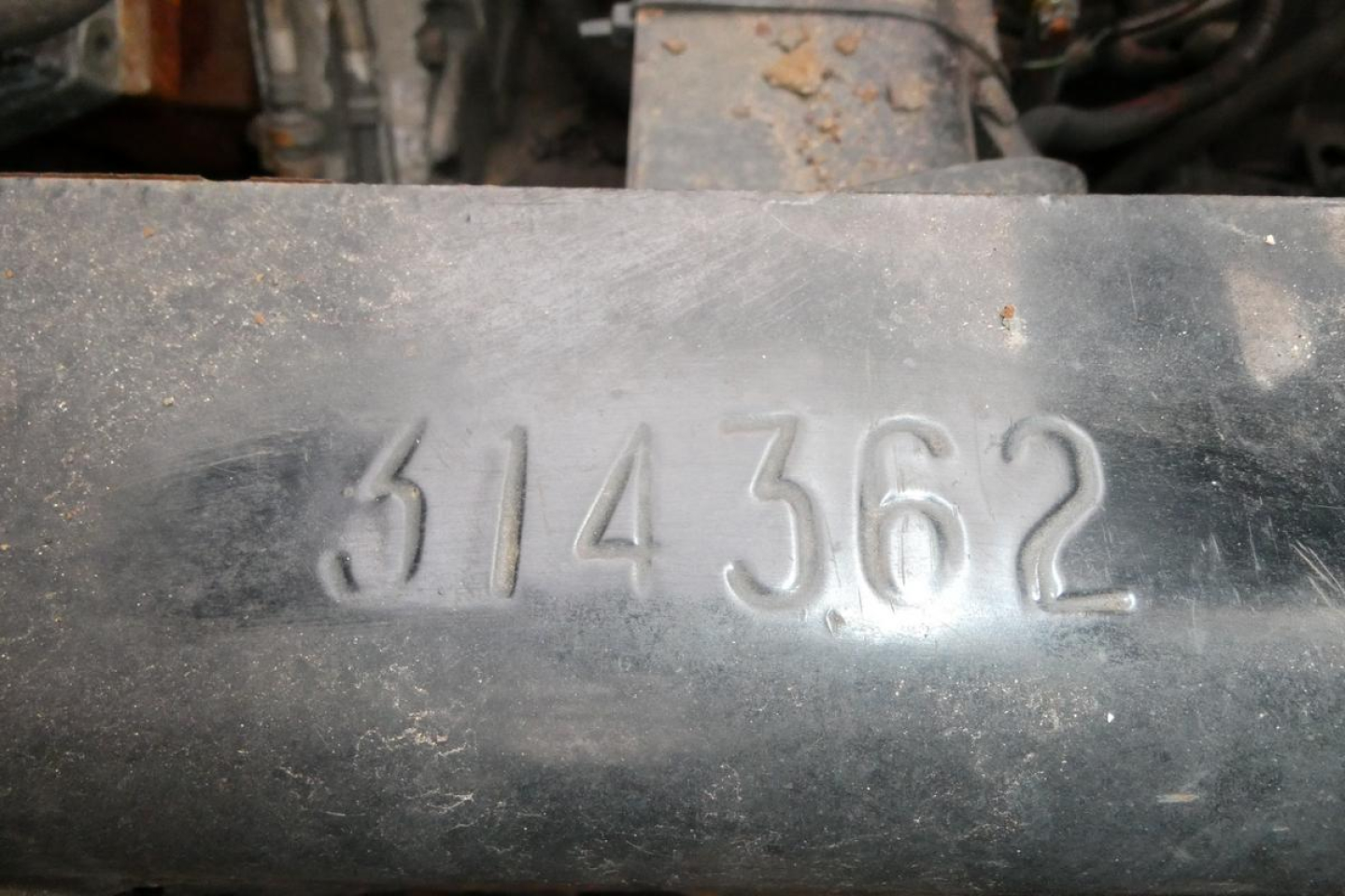 Metal engine component with stamped number '314362' visible in the center.
