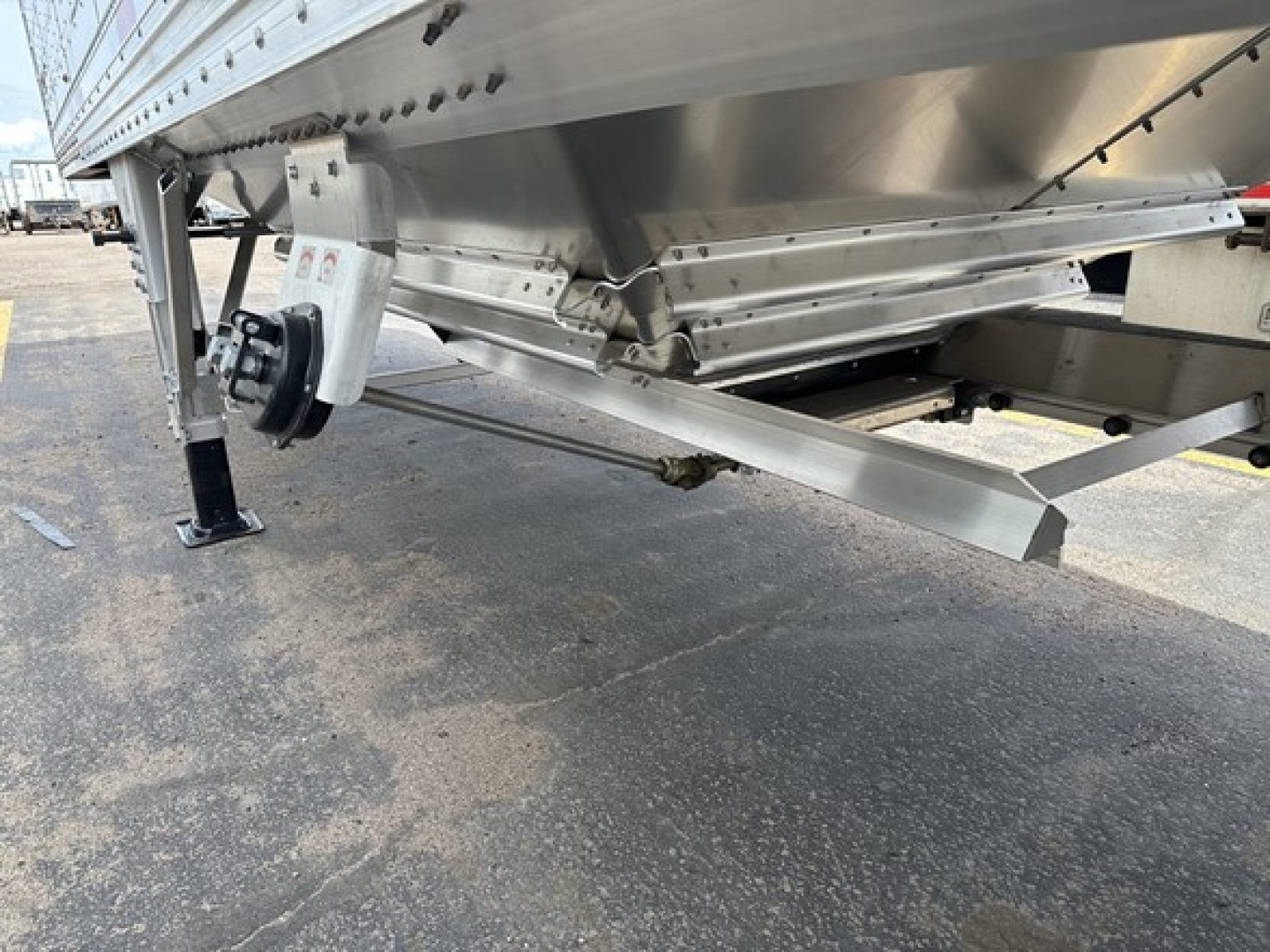 Trailer undercarriage showing aluminum hopper and landing gear for a Timpte Super Hopper.