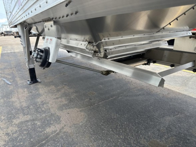 Trailer undercarriage showing aluminum hopper and landing gear for a Timpte Super Hopper.