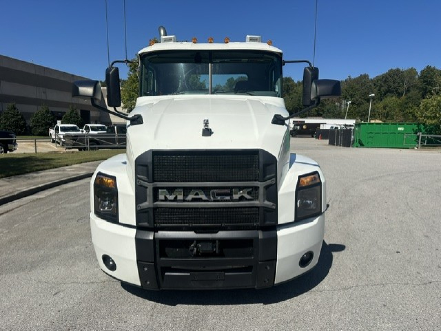 Front view of a white 2023 Mack Anthem 64T conventional daycab truck with large grille and Mack emblem, headlights, and bumper.