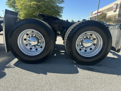 Mack ANTHEM 64T left and right rear dual tires on chassis showing polished steel wheels and tandem axle