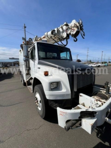 Truck cab and boom crane on Freightliner FL80 in-service condition with crane equipment mounted on the back, front grill and headlights visible.