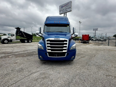 Freightliner Cascadia 126 cab-forward truck front view in blue with prominent grille and side mirrors.