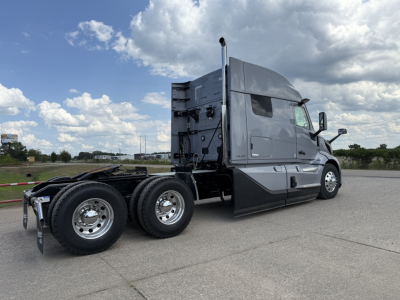 Volvo VNL64T840 truck cab and tandem axle with dual rear wheels visible in profile.