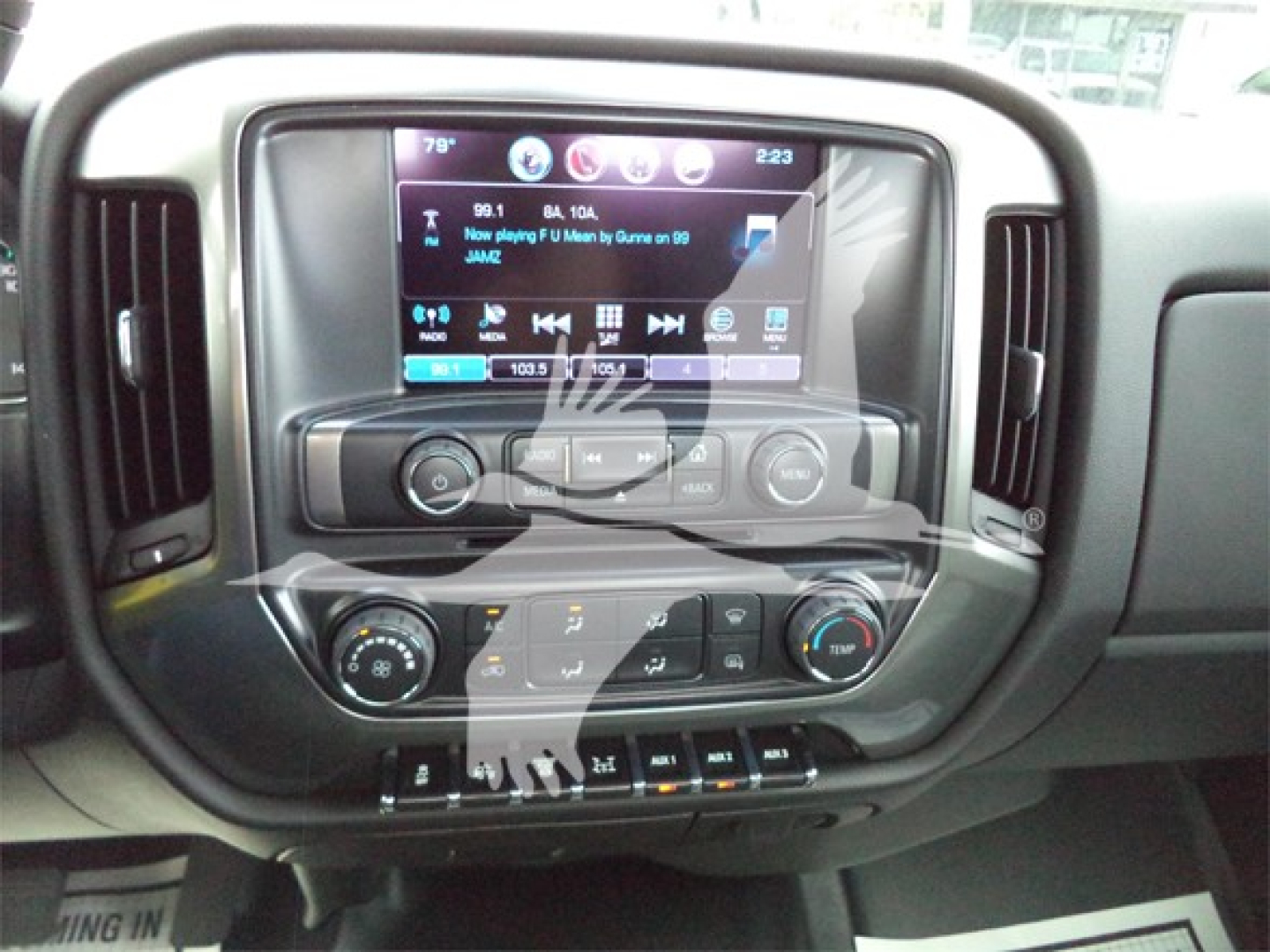 Dashboard of 2023 Chevrolet Silverado 6500HD showing touchscreen infotainment with climate controls and settings.