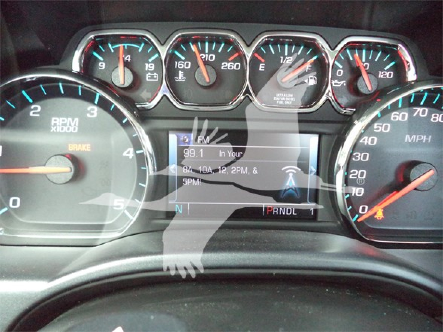Dashboard view showing speedometer and tachometer gauges with central digital display in Chevrolet Silverado 6500hd instrument cluster.