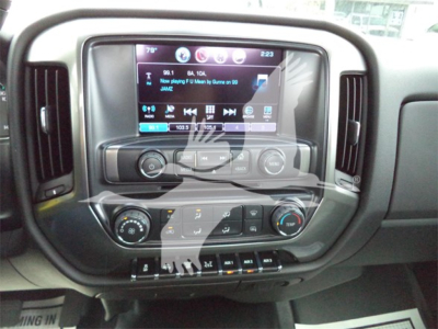 Dashboard of 2023 Chevrolet Silverado 6500HD showing touchscreen infotainment with climate controls and settings.