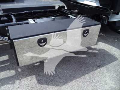 Chevrolet Silverado 6500HD rollback chassis with a dual-compartment toolbox mounted behind cab, visible on truck frame.