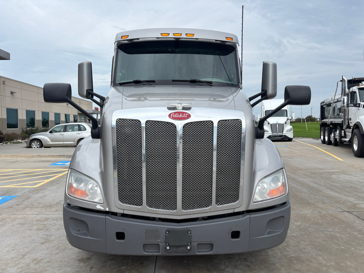 Peterbilt 579 front view showing grille, headlights, and bumper. Front badge and mirrors visible.
