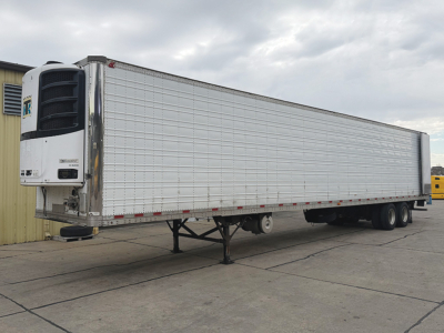 Great Dane Everest SS 2017 refrigerated trailer side view showing entry telematics unit and front refrigeration unit, flatbed style with landing gear and tandem axles.