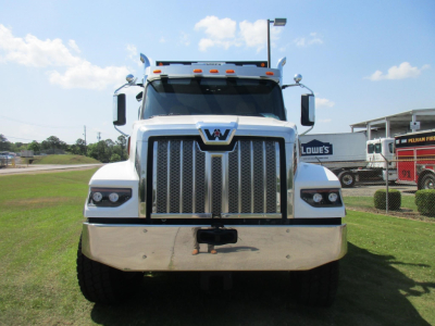 Front view of a white Western Star 49X dump truck with large grille and chrome bumper.