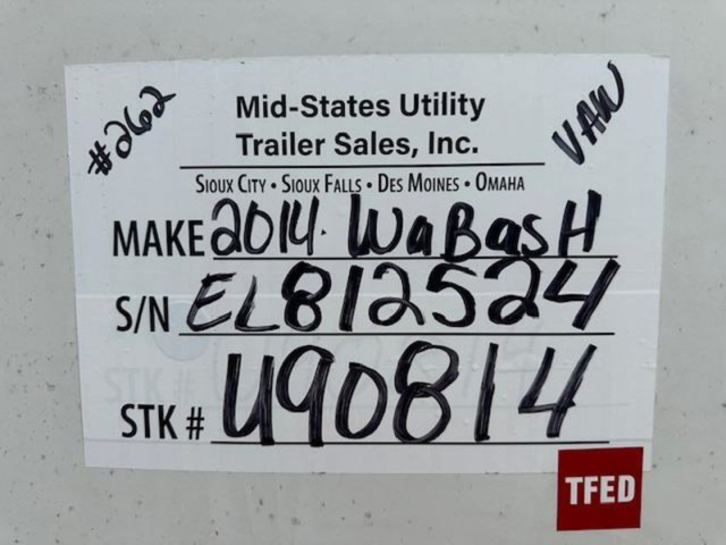 Label on trailer showing Make 2014 WABASH, S/N EL813524, STK # U90814, VF: MF Mid-States Utility Trailer Sales, Inc., TFED